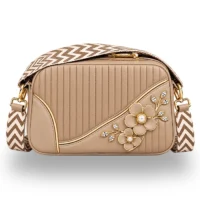 Elegant beige women's crossbody bag with floral detailing