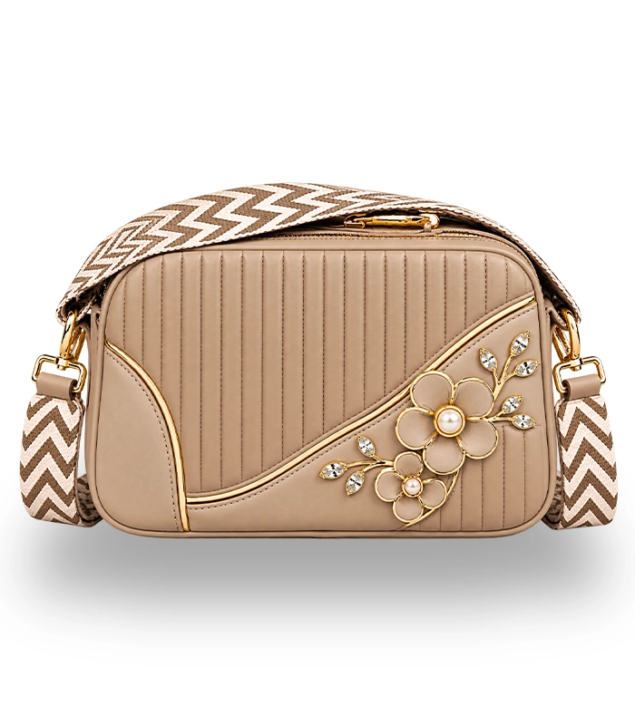 Elegant beige women's crossbody bag with floral detailing